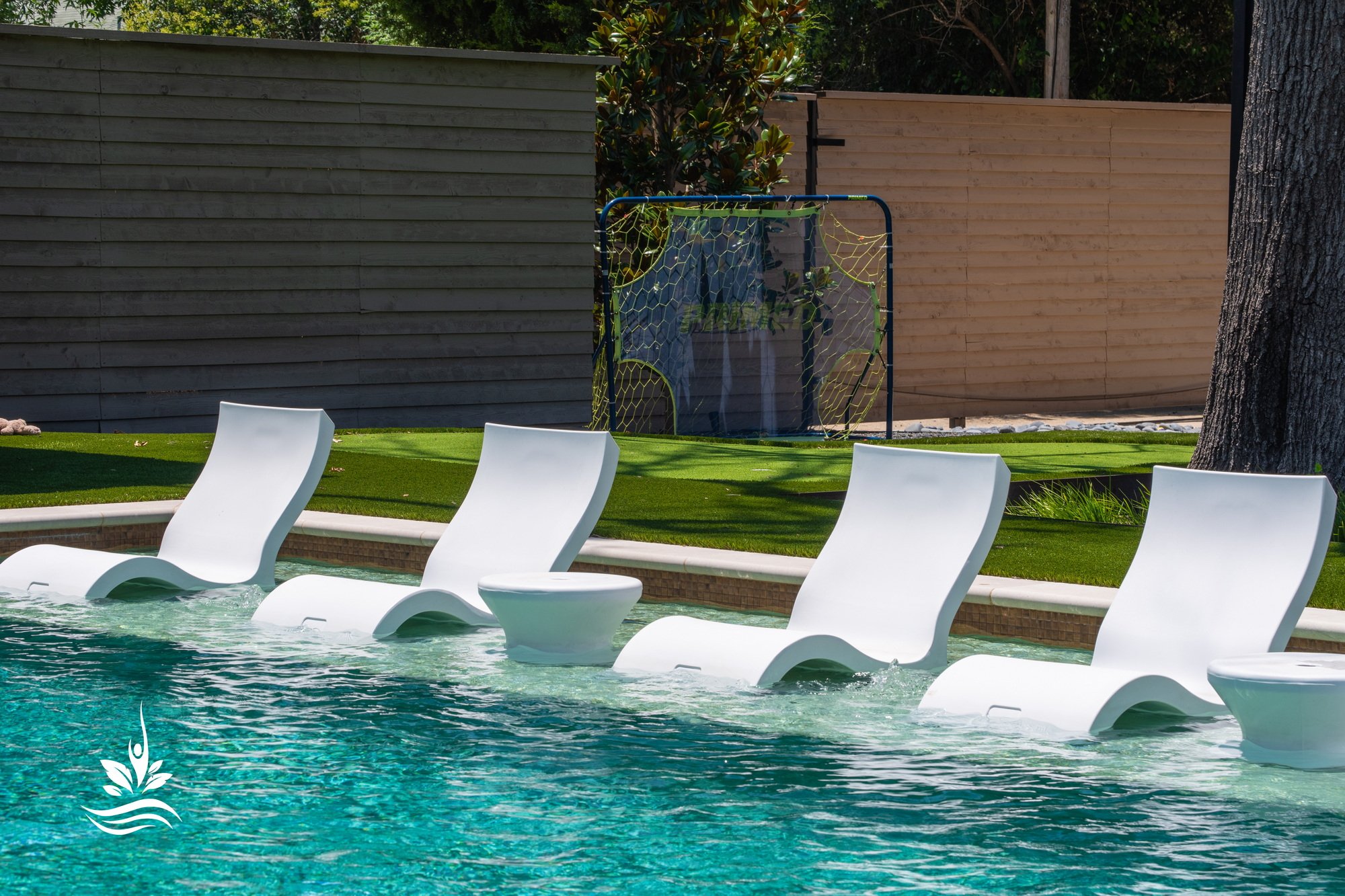 Pool chairs on a swimming pool tanning ledge